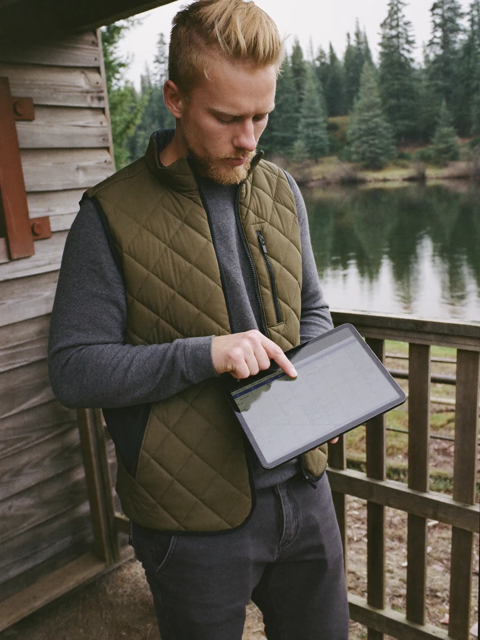 A club staff member checking the roster on an iPad in the field